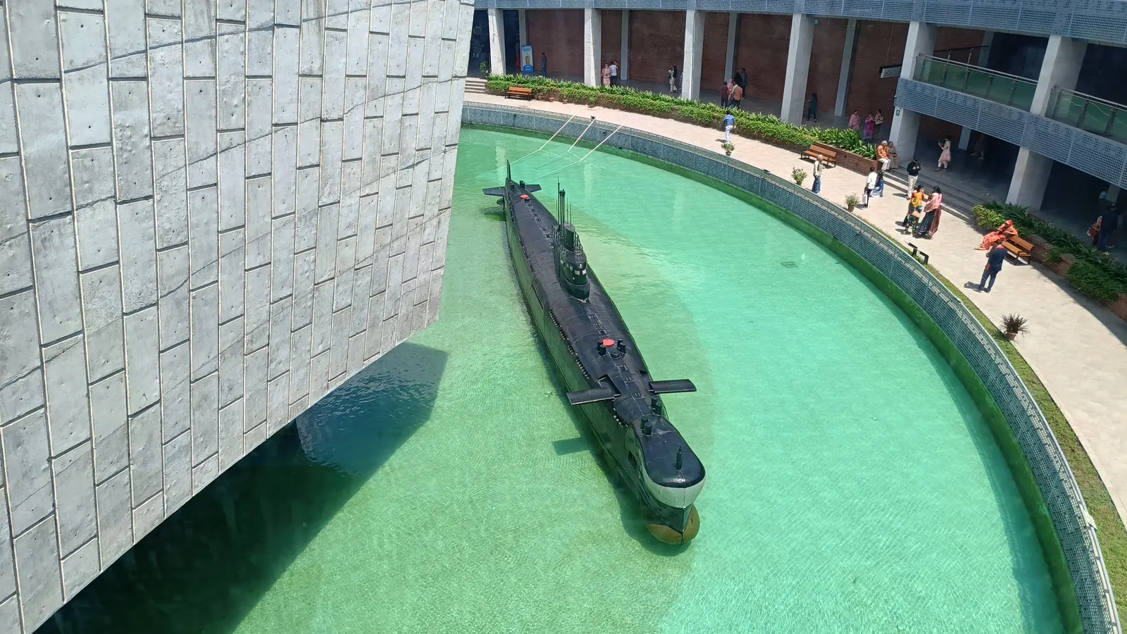 A decommissioned submarine moored in the reflecting pool at the military museum