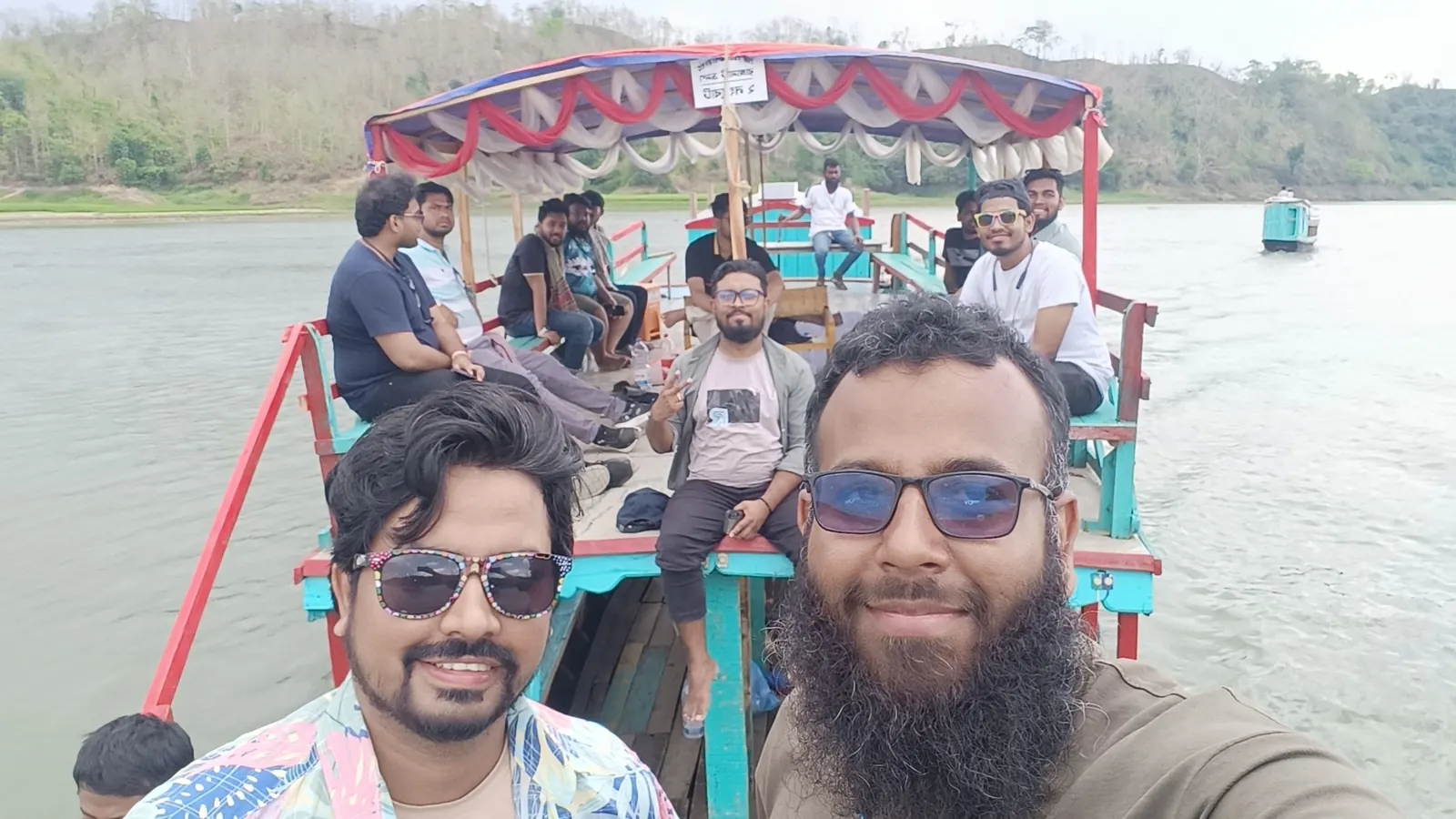 Selfie from the back of the canopied tour boat with the group aboard