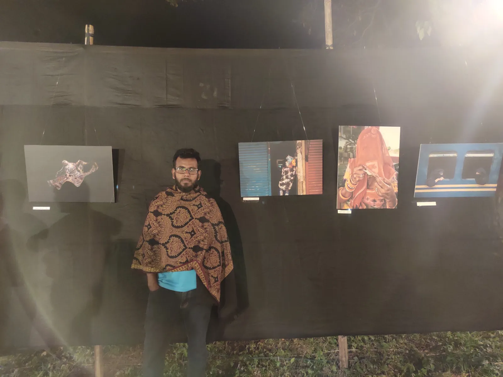 At an outdoor night photo exhibition on campus