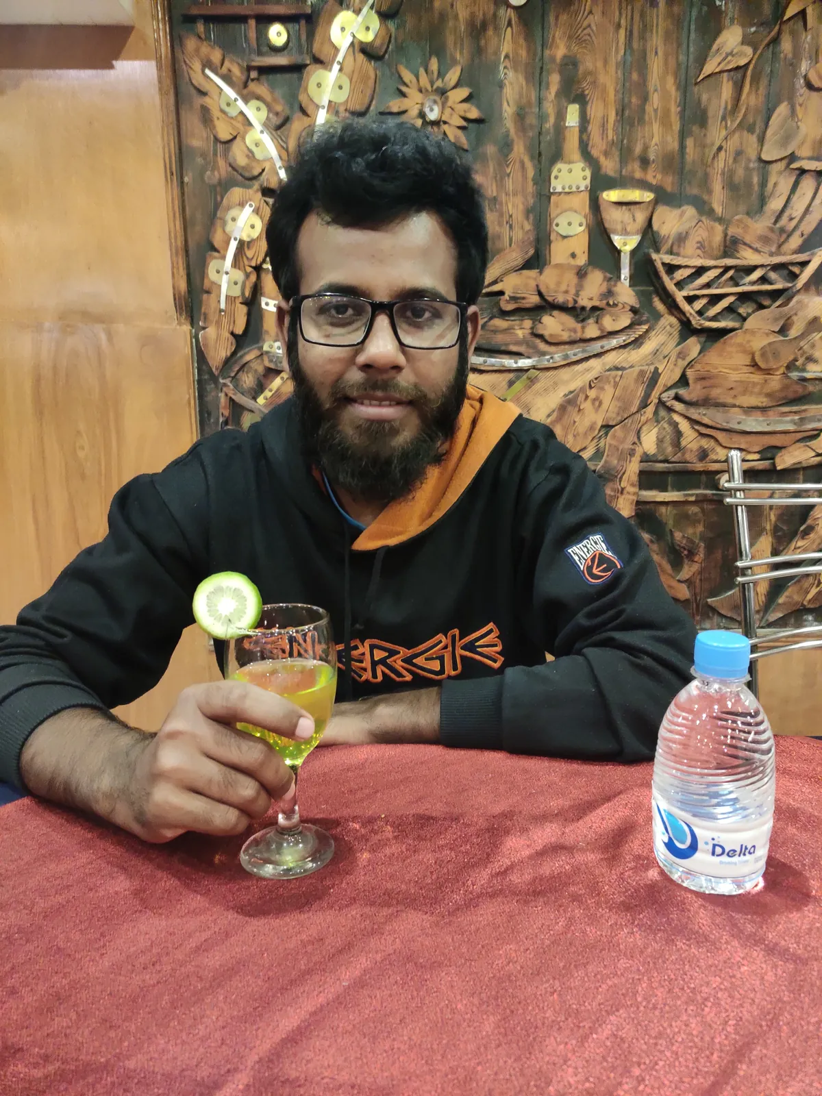A mocktail at a red-clothed restaurant table