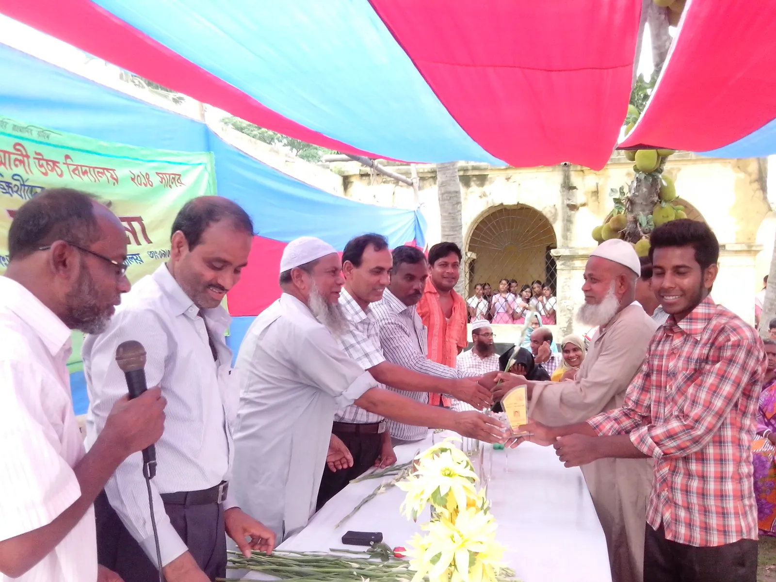 Receiving a trophy at the school prize-giving ceremony