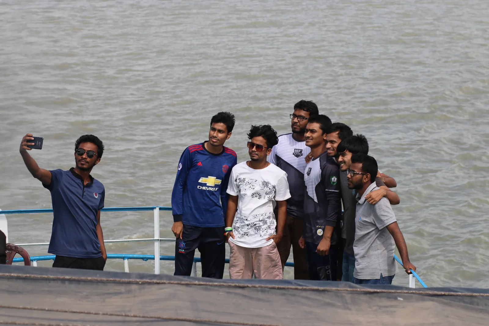 Boat-deck selfie with the tour group on the wide river